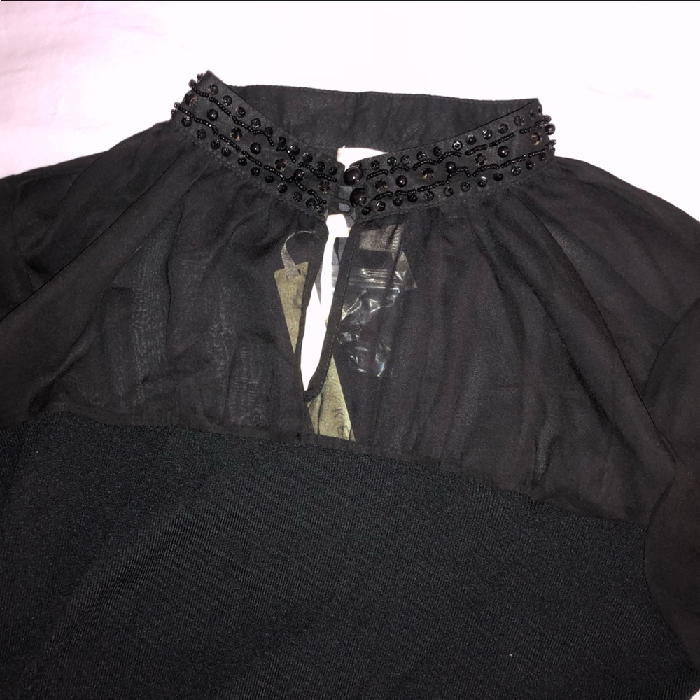 Black sheer shoulder fancy top with high neck and sparkly collar